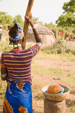 Fulani Woman Grinding Grain